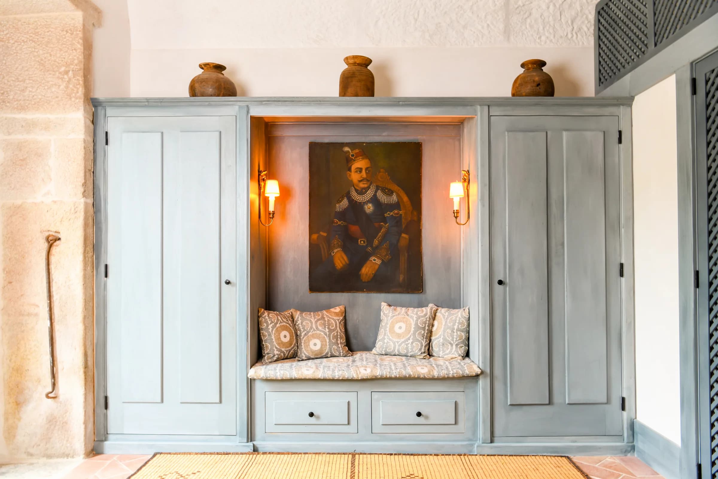 The Azalee suite — a built-in wardrobe with a painted portrait niche
