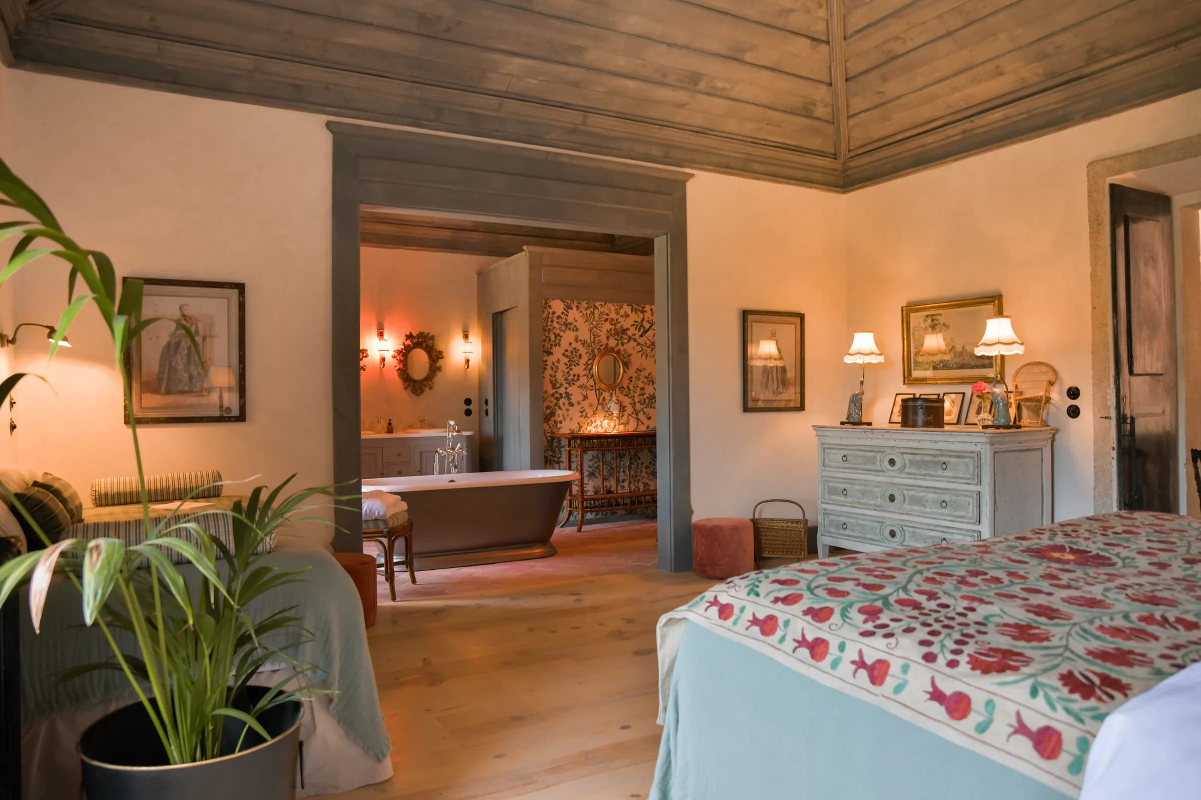 The Camelia suite — a blue chest of drawers before the fireplace