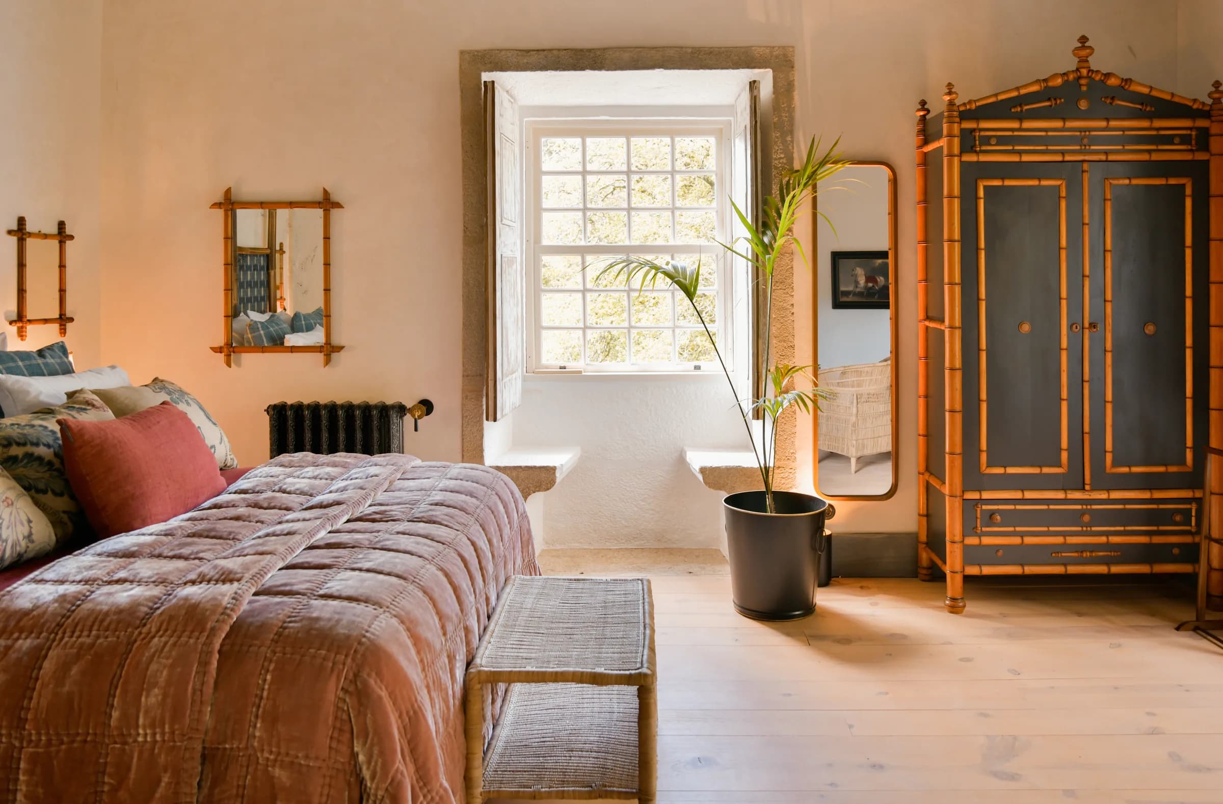 The Dahlia suite — the bed seen from the garden window
