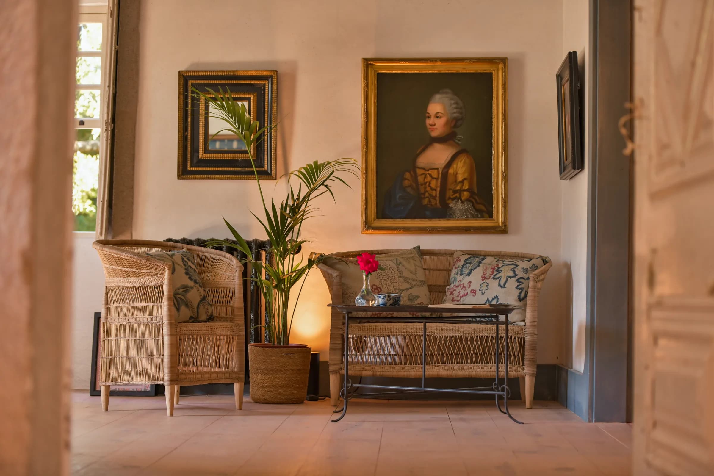 The Dahlia suite — a sitting corner with an antique portrait