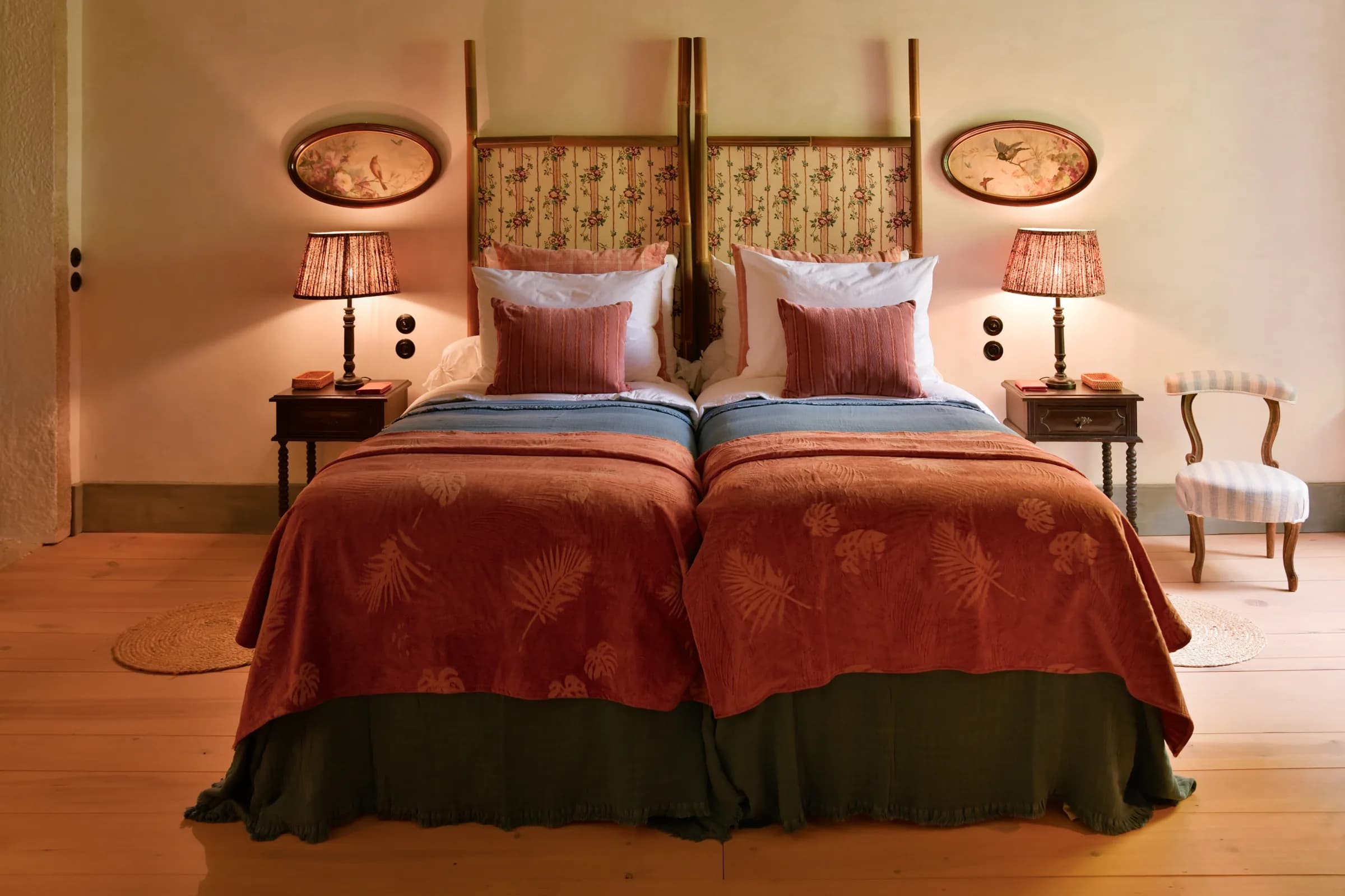The Lilas suite — twin beds dressed in rust and indigo