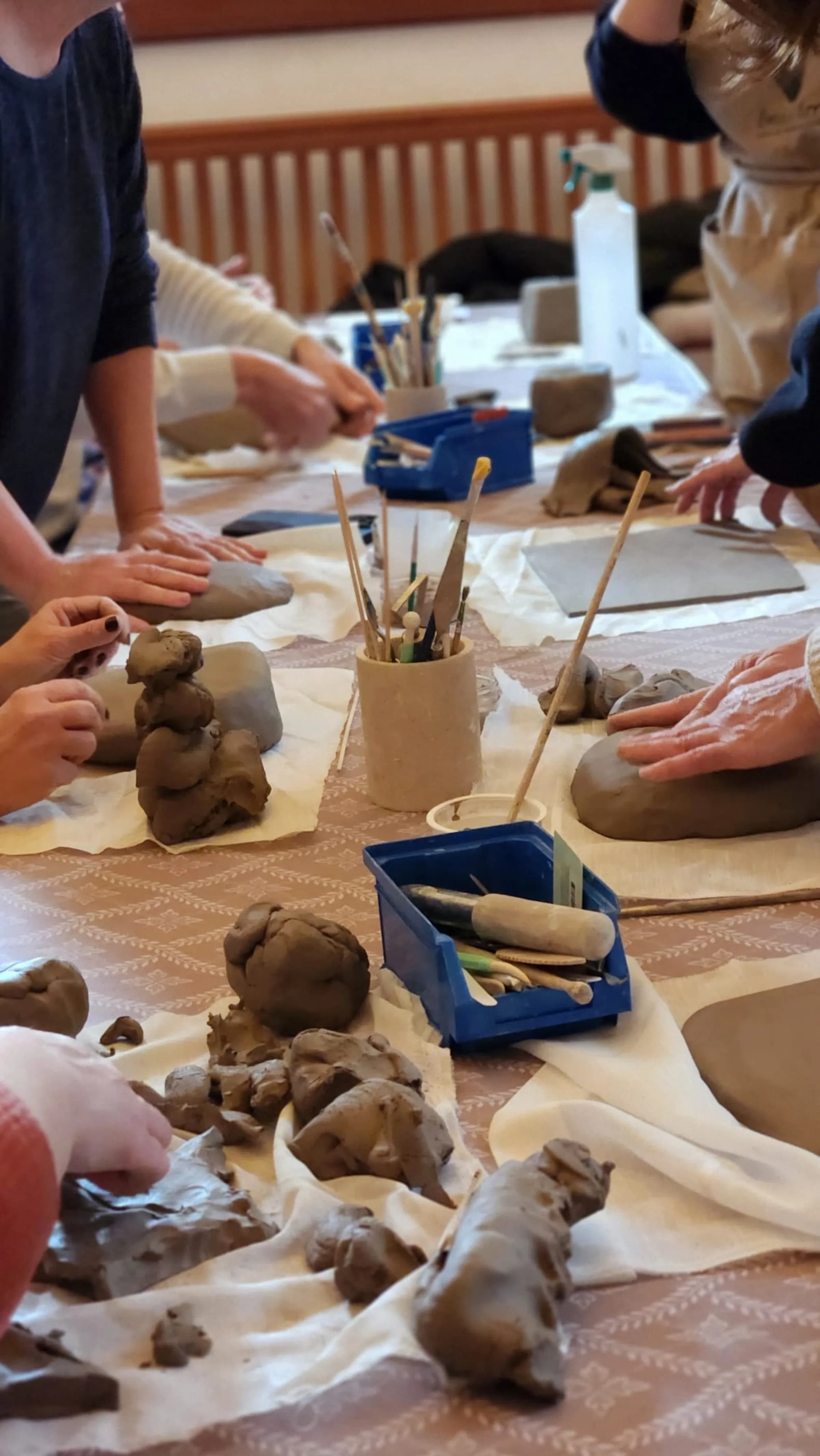 An artisan craft workshop, hands at work on a handmade piece