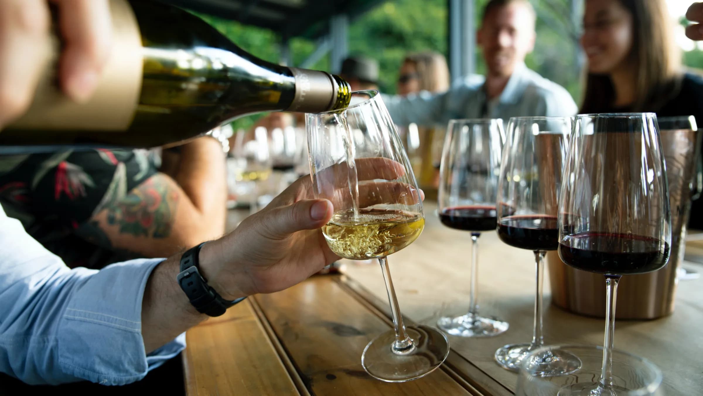 A wine tasting with local producers, glasses poured at an outdoor table